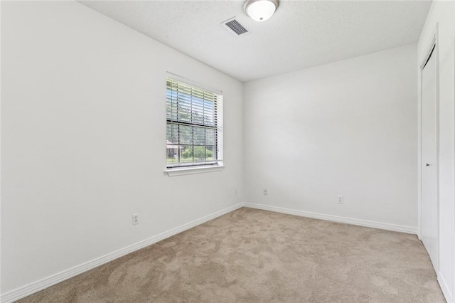 205 Timber Ridge Dr, Slidell, LA 70460 - unfurnished room featuring light carpet and a textured ceiling