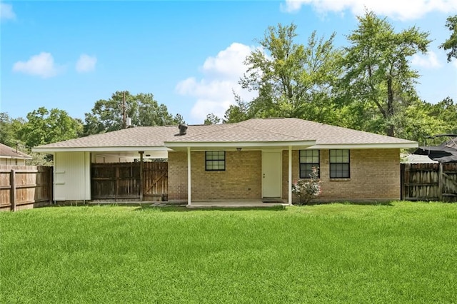 205 Timber Ridge Dr, Slidell, LA 70460 - back of house featuring brick siding and a fenced backyard