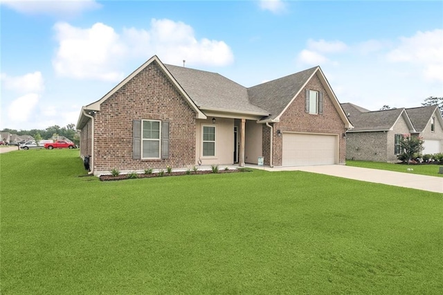 42030 Wood Ave, Ponchatoula, LA 70454 - view of front facade with brick siding, a front yard, driveway, and an attached garage