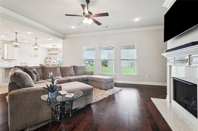 42030 Wood Ave, Ponchatoula, LA 70454 - living area with a ceiling fan, a fireplace, dark wood finished floors, recessed lighting, and a chandelier