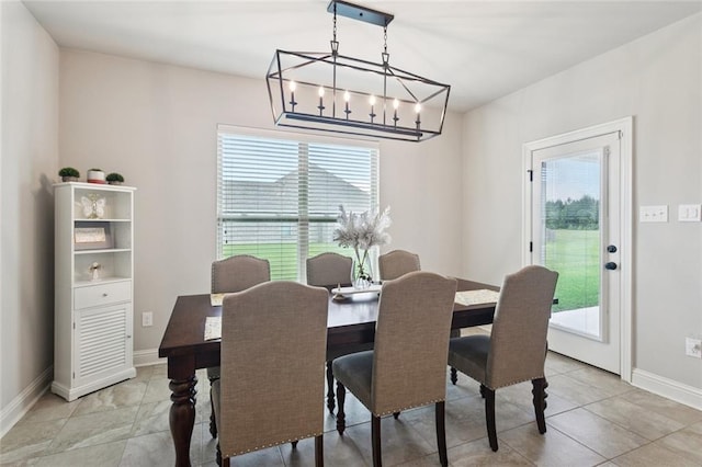 42030 Wood Ave, Ponchatoula, LA 70454 - dining room featuring healthy amount of natural light, a chandelier, and light tile patterned floors