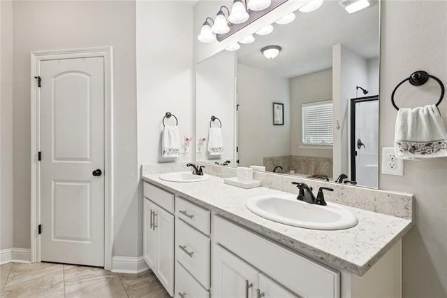 42030 Wood Ave, Ponchatoula, LA 70454 - bathroom featuring double vanity and baseboards