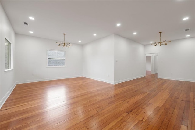 5624-5626 Annunciation St, New Orleans, LA 70115 - spare room featuring a chandelier, light wood finished floors, and recessed lighting