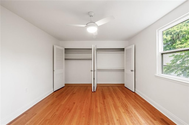 5624-5626 Annunciation St, New Orleans, LA 70115 - unfurnished bedroom featuring two closets, light wood finished floors, and ceiling fan