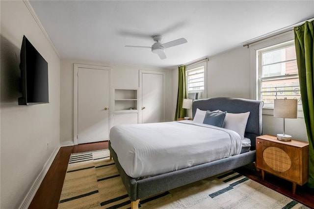 5624-5626 Annunciation St, New Orleans, LA 70115 - bedroom with wood finished floors and ceiling fan