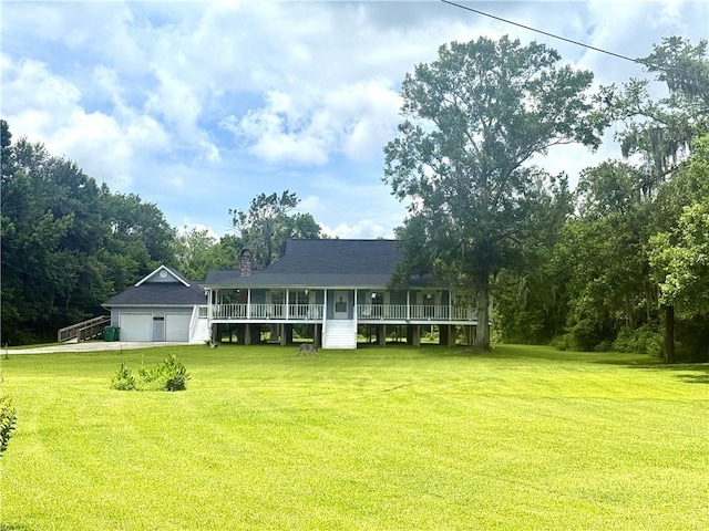 7282 Barataria Blvd, Marrero, LA 70072 - view of front facade with a front yard, an attached garage, driveway, and a chimney
