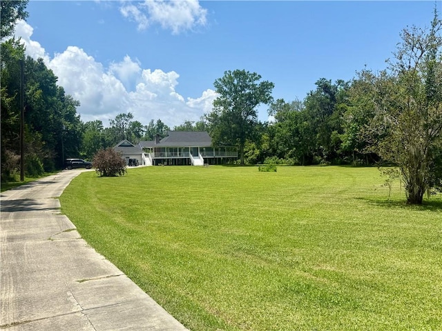 7282 Barataria Blvd, Marrero, LA 70072 - view of front of home featuring a front lawn