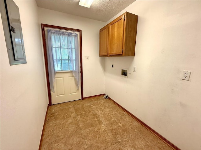 7282 Barataria Blvd, Marrero, LA 70072 - washroom featuring electric panel, cabinet space, washer hookup, a textured ceiling, and electric dryer hookup