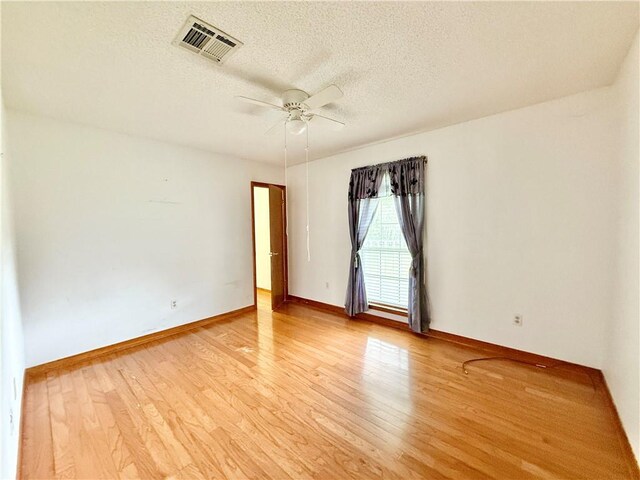 7282 Barataria Blvd, Marrero, LA 70072 - unfurnished room featuring ceiling fan, light wood-style flooring, and a textured ceiling