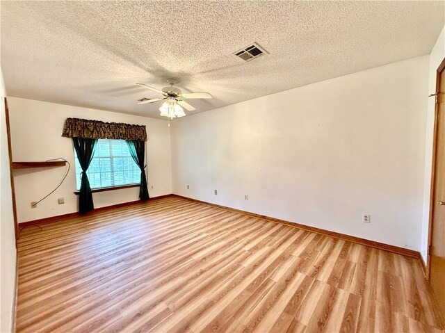 7282 Barataria Blvd, Marrero, LA 70072 - unfurnished room featuring light wood-style flooring, a textured ceiling, and ceiling fan