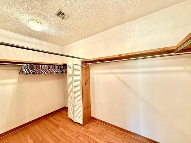 7282 Barataria Blvd, Marrero, LA 70072 - walk in closet featuring light wood-type flooring