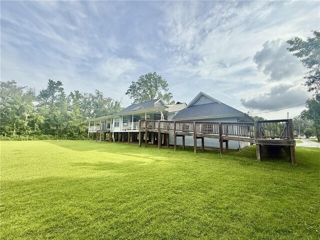 7282 Barataria Blvd, Marrero, LA 70072 - rear view of property featuring a wooden deck and a yard
