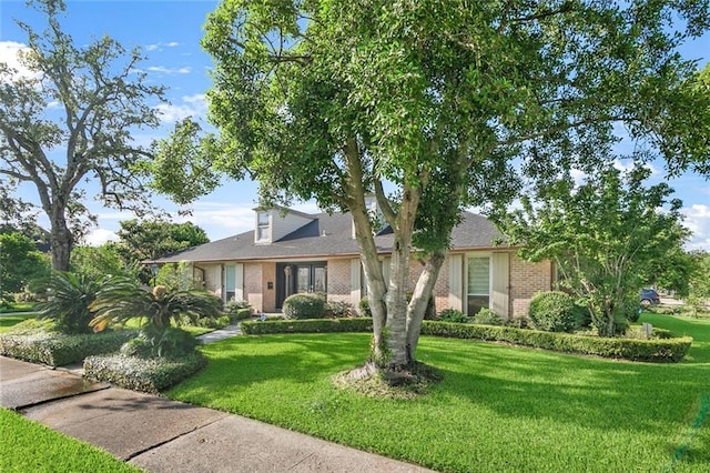 700 Crystal St, New Orleans, LA 70124 - view of front of house featuring brick siding and a front lawn
