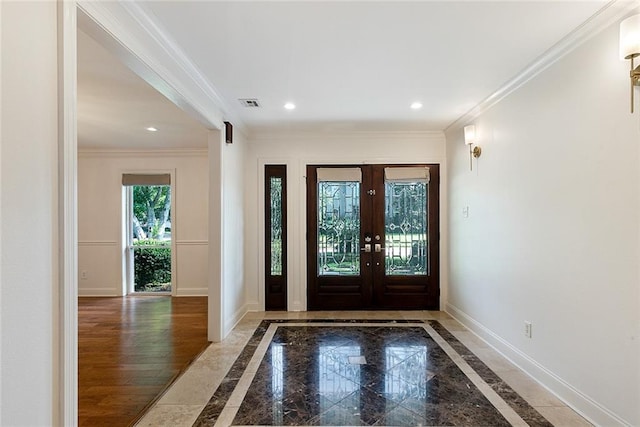 700 Crystal St, New Orleans, LA 70124 - foyer entrance with inlaid floor details, ornamental molding, recessed lighting, and french doors