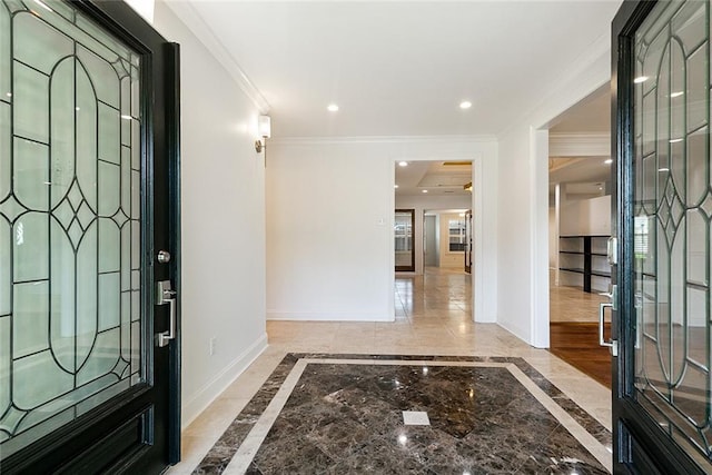 700 Crystal St, New Orleans, LA 70124 - foyer featuring inlaid floor details, ornamental molding, marble tiled floors, and recessed lighting