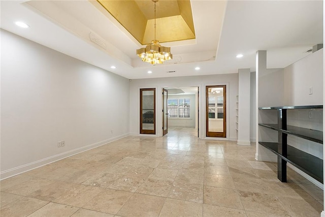 700 Crystal St, New Orleans, LA 70124 - unfurnished room featuring a tray ceiling, a chandelier, and recessed lighting
