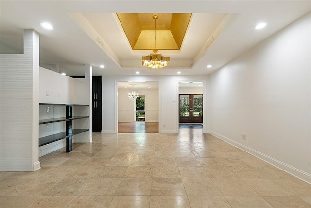 700 Crystal St, New Orleans, LA 70124 - unfurnished living room featuring a chandelier, a tray ceiling, and recessed lighting