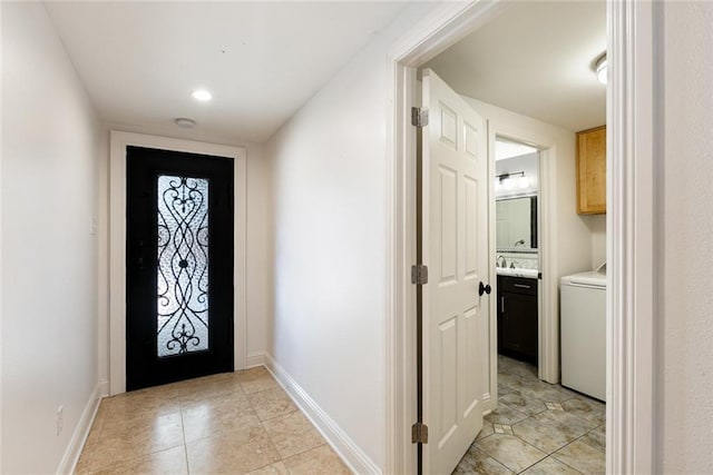 700 Crystal St, New Orleans, LA 70124 - foyer entrance with washer / clothes dryer and light tile patterned floors