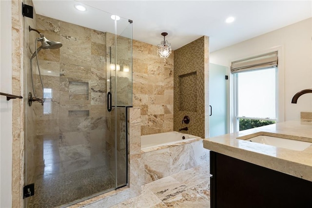 700 Crystal St, New Orleans, LA 70124 - bathroom with vanity, a bath, a shower stall, and recessed lighting