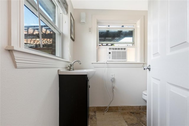 700 Crystal St, New Orleans, LA 70124 - half bath with vanity, plenty of natural light, and cooling unit