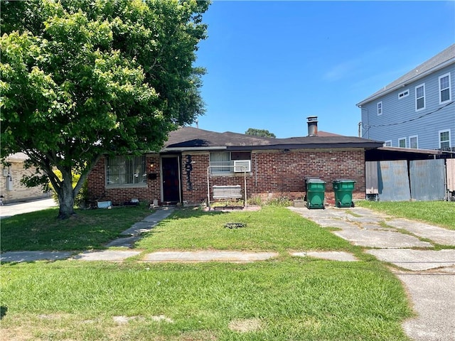3913 Civic St, Metairie, LA 70001 - view of front facade featuring brick siding and a front lawn