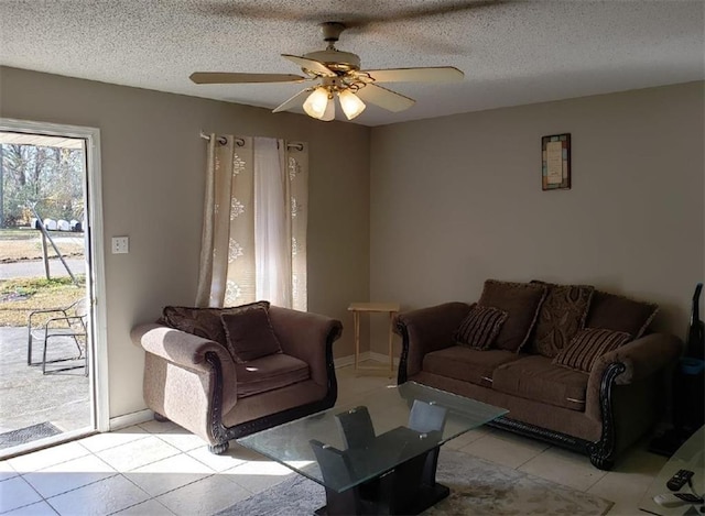11539 Wendell Ln, Hammond, LA 70401 - living area featuring light tile patterned flooring, ceiling fan, and a textured ceiling