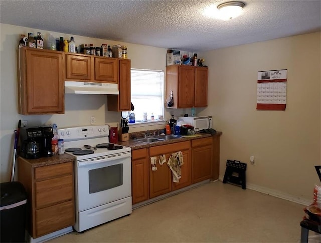 11539 Wendell Ln, Hammond, LA 70401 - kitchen with electric stove, under cabinet range hood, brown cabinets, a textured ceiling, and dark countertops
