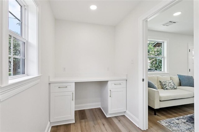 3009 Sundorn St, Jefferson, LA 70121 - office with built in desk, wood finished floors, and recessed lighting