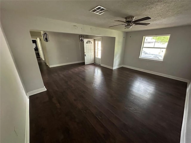 1505 Saint Ann Pl, Slidell, LA 70460 - spare room with healthy amount of natural light, ceiling fan, dark wood-style floors, and a textured ceiling