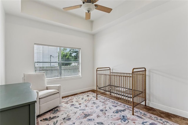 1580 Cherry Ridge Ct, Mandeville, LA 70448 - tiled bedroom with a nursery area and ceiling fan