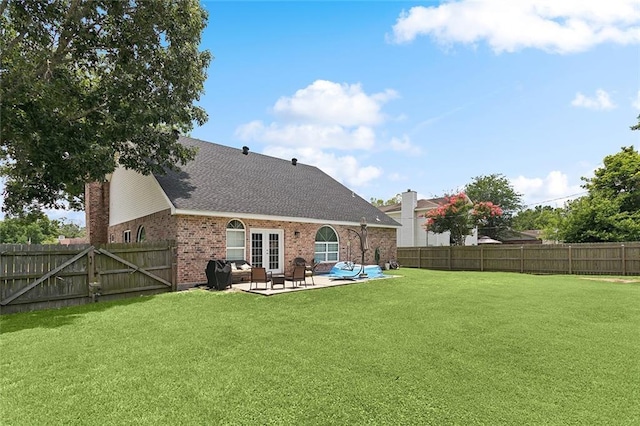 1580 Cherry Ridge Ct, Mandeville, LA 70448 - back of house with french doors, a patio area, a fenced backyard, and brick siding