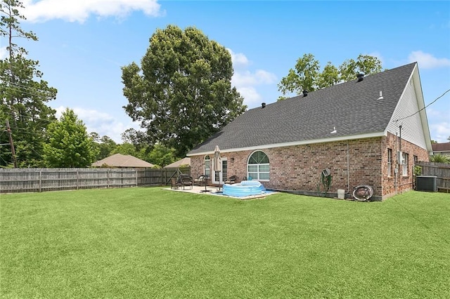 1580 Cherry Ridge Ct, Mandeville, LA 70448 - rear view of property featuring a patio, brick siding, a fenced backyard, and a shingled roof