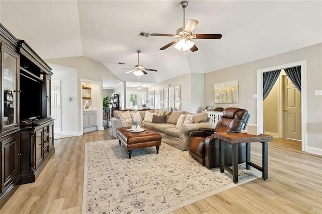 33 Rosedown Dr, Destrehan, LA 70047 - living area featuring a ceiling fan, lofted ceiling, and light wood-style flooring