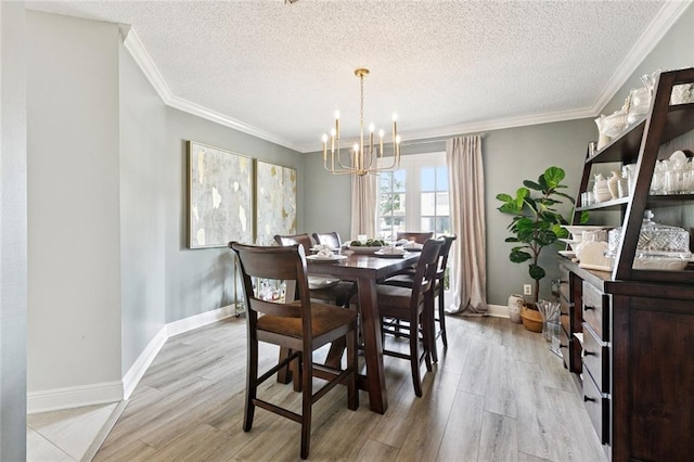 33 Rosedown Dr, Destrehan, LA 70047 - dining room with a chandelier, light wood-type flooring, a textured ceiling, and crown molding