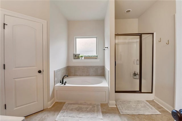 17509 Waterloo Dr, Baton Rouge, LA 70817 - bathroom featuring a shower stall, a garden tub, and tile patterned floors