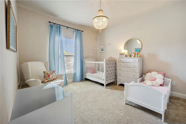 17509 Waterloo Dr, Baton Rouge, LA 70817 - bedroom with carpet floors, a chandelier, and a crib