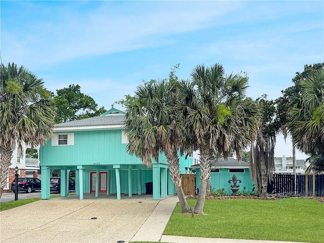 4230 Murano Rd, New Orleans, LA 70129 - view of property featuring a carport and driveway