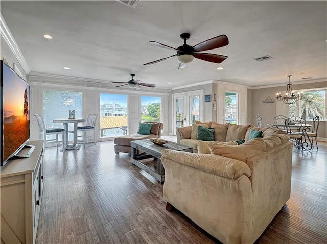 4230 Murano Rd, New Orleans, LA 70129 - living area featuring crown molding, a chandelier, dark wood-style floors, recessed lighting, and a ceiling fan