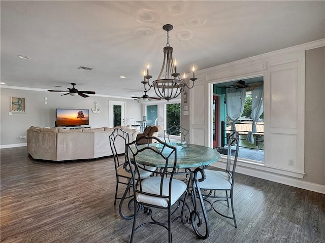 4230 Murano Rd, New Orleans, LA 70129 - dining space with a chandelier, crown molding, a ceiling fan, dark wood-style floors, and healthy amount of natural light