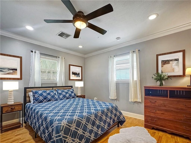 4230 Murano Rd, New Orleans, LA 70129 - bedroom featuring wood finished floors, recessed lighting, crown molding, and a ceiling fan