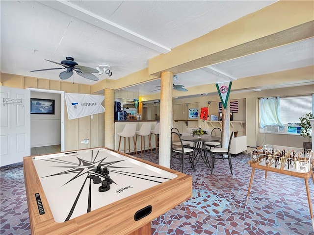 4230 Murano Rd, New Orleans, LA 70129 - rec room with a ceiling fan, decorative columns, stone finish flooring, and beam ceiling
