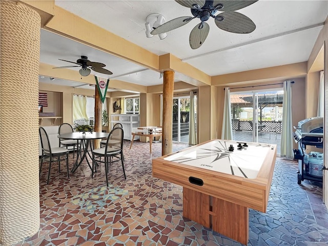 4230 Murano Rd, New Orleans, LA 70129 - recreation room with a ceiling fan and stone finish floors