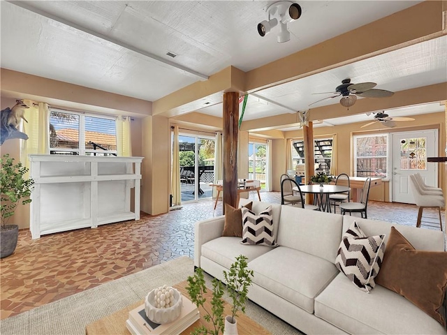 4230 Murano Rd, New Orleans, LA 70129 - living room with healthy amount of natural light and a ceiling fan