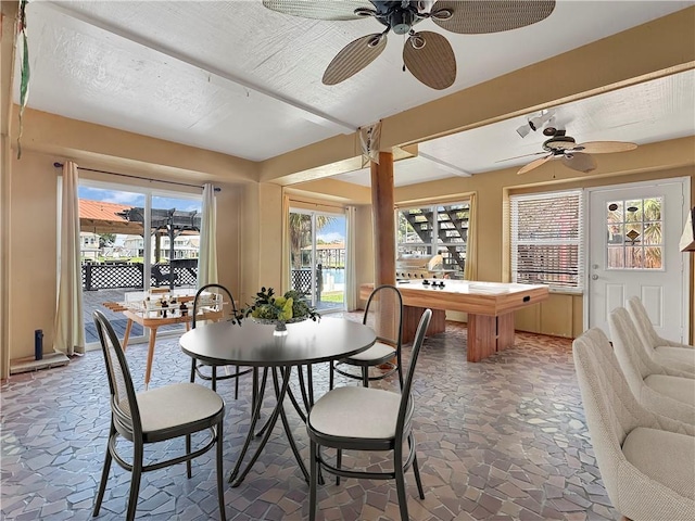 4230 Murano Rd, New Orleans, LA 70129 - dining room with stone tile flooring and a ceiling fan