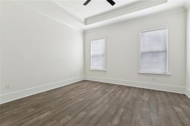 2342 Odin St, New Orleans, LA 70122 - empty room with a raised ceiling, dark wood-style floors, and a ceiling fan