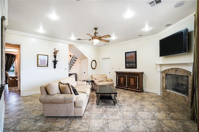 601 Ferriday Ct, Harahan, LA 70123 - living area featuring stairway, crown molding, a premium fireplace, ceiling fan, and stone finish flooring