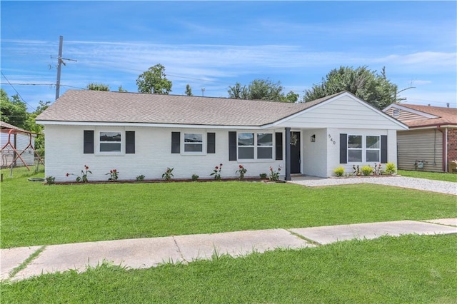 540 Ruth Dr, Westwego, LA 70094 - ranch-style home with a front yard, brick siding, and a shingled roof