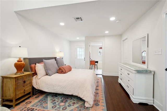 1131 N Roman St, New Orleans, LA 70116 - bedroom featuring dark wood-style flooring and recessed lighting
