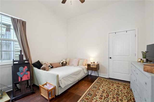 1131 N Roman St, New Orleans, LA 70116 - bedroom featuring multiple windows, dark wood-style flooring, and a ceiling fan