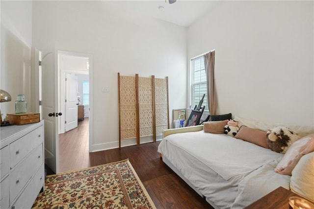 1131 N Roman St, New Orleans, LA 70116 - bedroom with dark wood-style floors, multiple windows, and a high ceiling